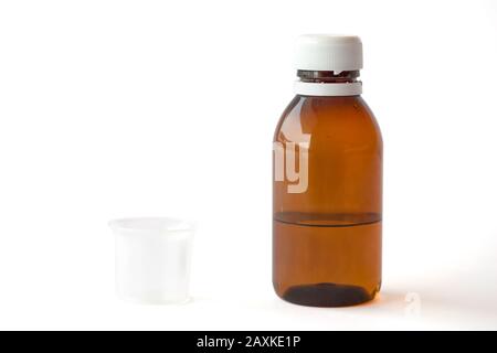 Download Medical Bottle And Measuring Plastic Cup With Medicinal Syrup On White Background Studio Photo Stock Photo Alamy PSD Mockup Templates