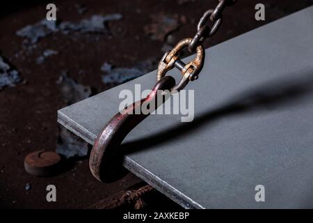 Crane chain and hook at an industrial plant. hooks for lifting steel Stock Photo