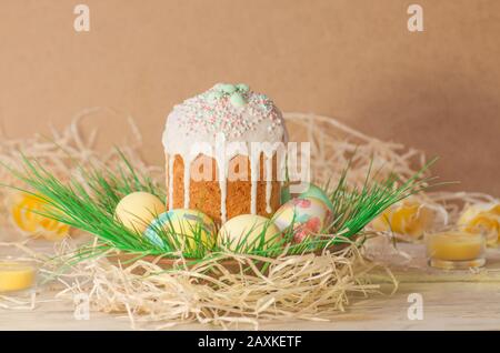 Pastel Easter egg. Pastel colored decorated easter eggs and Easter cake. Pastel colored Easter holiday background. Sweet spring color theme. Easter eg Stock Photo