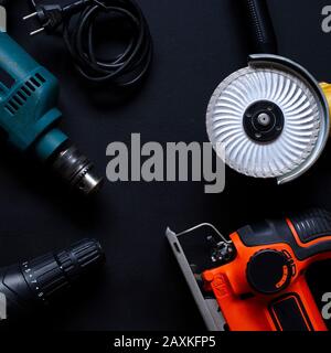 Construction worker tools on a dark background top view. Stock Photo