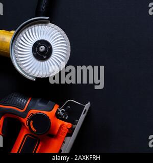 Construction worker tools on a dark background top view. Stock Photo