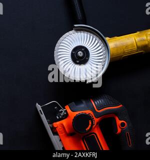 Construction worker tools on a dark background top view. Stock Photo