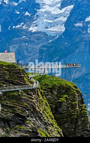 Mountain trail and platform First Cliff Walk presented by Tissot against the rock faces of the Bernese Alps, Grindelwald, Bernese Oberland, Switzerlan Stock Photo