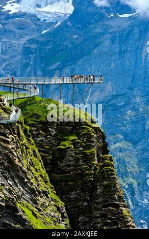 Mountain trail and platform First Cliff Walk presented by Tissot against the rock faces of the Bernese Alps, Grindelwald, Bernese Oberland, Switzerlan Stock Photo