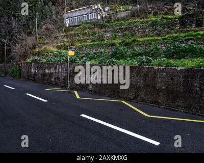 Local bus-stop on road through the historic Nun's Valley in rural Madeira, Portugal, European Union Stock Photo