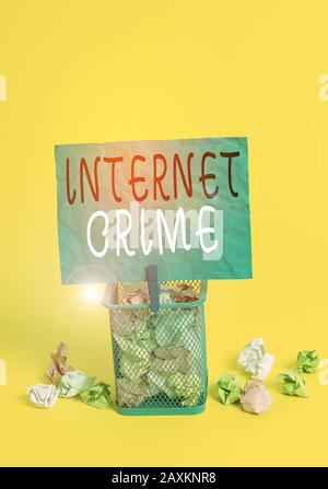 Writing note showing Internet Crime. Business concept for crime or illegal online activity committed on the Internet Trash bin crumpled paper clothesp Stock Photo