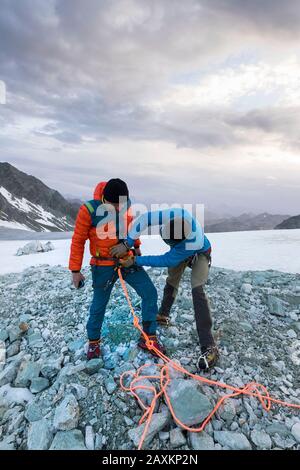 Mountaineers on the way to the Bishorn summit, rope in for safety on the glacier Stock Photo