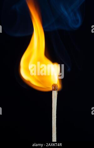 Flame and smoke on the matchsticks over black background Stock Photo