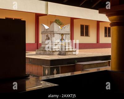 Holy basil or tulasi vrindavan.Traditional interiors of a temple in a village in India. Stock Photo