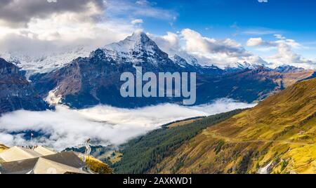 People admiring the autumn landscape from elevated walkway (Cliff Walk by Tissot), First, Grindelwald, Canton of Bern, Switzerland Stock Photo