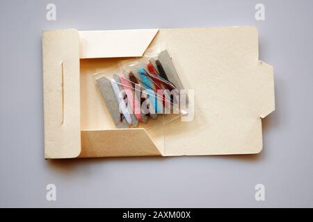 Sewing kit isolated on grey background Stock Photo