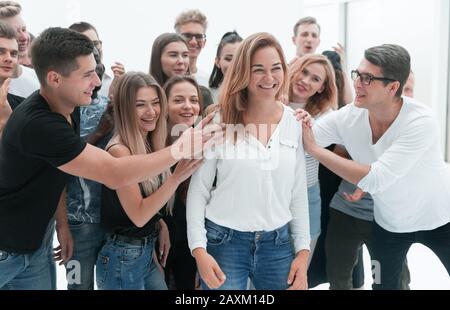 group of young people supporting their leader Stock Photo