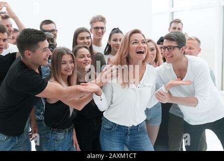 group of young people supporting their happy leader Stock Photo