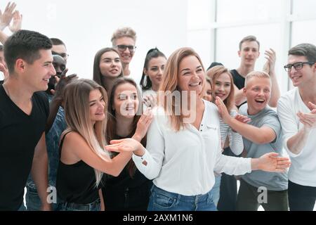 group of young people supporting their happy leader Stock Photo