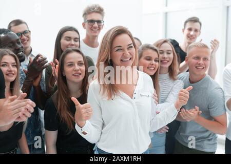 group of young people supporting their happy leader Stock Photo