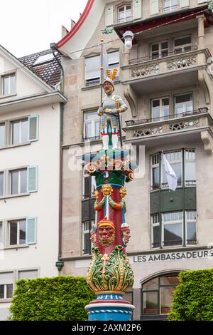 Lucerne, Switzerland - May 7, 2017: The Fritschi fountain with standard-bearer statue was erected in 1918 Stock Photo