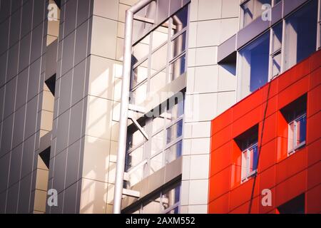 facade, front of the house red and gray in the high-tech style different details on a bright sunny day Stock Photo