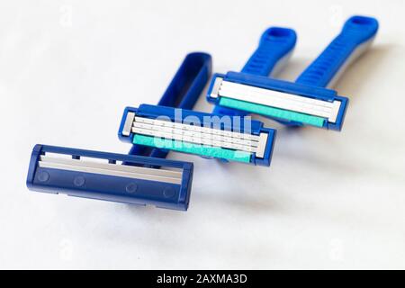 The Blue razor with sharp blade for mans. Three razors on light background Stock Photo