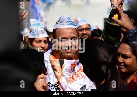 February 11, 2020: Supporters of Aam Aadmi Party (AAP) celebrate the victory in regional elections in India's capital New Delhi on 11 February 2020. AAP supporters gathered and celebrated across New Delhi mainly at party head office after the sweeping win against the Prime Minister of India Narendra Modi's party. Credit: Muzamil Mattoo/IMAGESLIVE/ZUMA Wire/Alamy Live News Stock Photo