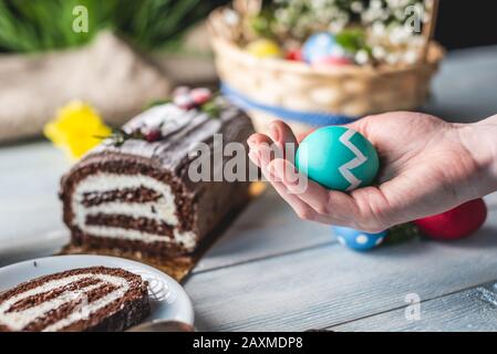 Festive Easter lunch with colorful bright eggs in a basket and an ...