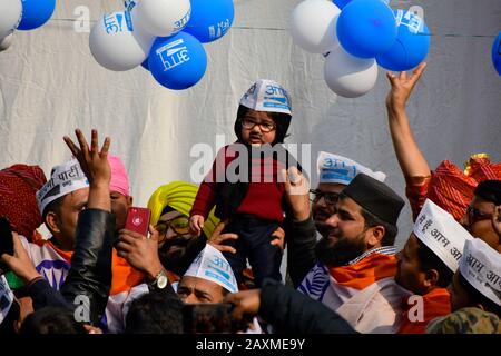 February 11, 2020: A young supporter of Aam Aadmi Party (AAP) dressed as Delhi's Chief Minister Arvind Kejriwal celebrates victory in regional elections in India's capital New Delhi on 11 February 2020. AAP supporters gathered and celebrated across New Delhi mainly at party head office after the sweeping win against the Prime Minister of India Narendra Modi's party. Credit: Muzamil Mattoo/IMAGESLIVE/ZUMA Wire/Alamy Live News Stock Photo