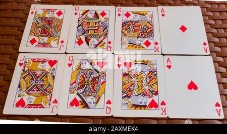 A playing card is a piece of specially prepared card stock, heavy paper, thin cardboard, plastic-coated paper, cotton-paper blend, or thin plastic tha Stock Photo