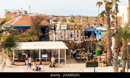 Jaffa, Israel - February 4, 2017: People sitting in cafe in downtown of the ancient city Jaffa, Tel Aviv, Israel Stock Photo