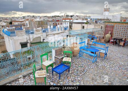 TUNIS, TUNISIA - DECEMBER 29 2019: Colorful tiled terraces overlooking the medina, with a panoramic view Stock Photo