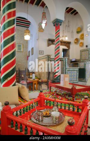 TUNIS, TUNISIA - JANUARY 01, 2020: The impressive colorful interior of El Mrabet Cafe, located inside the medina, with twisted columns Stock Photo