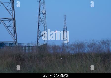 Partial Lunar Eclipse at dusk Stock Photo