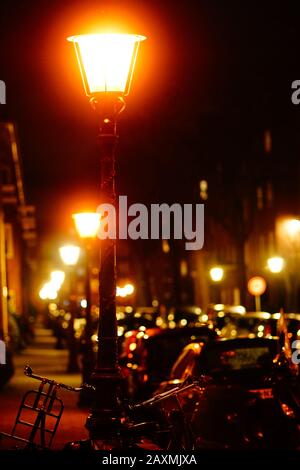 red lights on top of street lamps