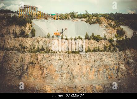 panorama of granite quarry with the machines to work, general view Stock Photo