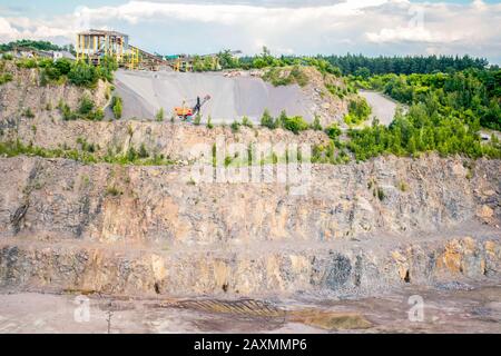 panorama of granite quarry with the machines to work, general view Stock Photo