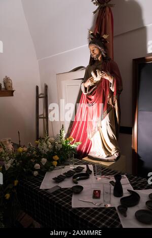 AVETRANA, ITALY - APRIL 19, 2019 - Exhibition of religious art during Holy Week. The statue of Christ during The Last Supper on Holy Thursday Stock Photo
