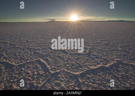 Irregular structures of salt at sunrise Stock Photo