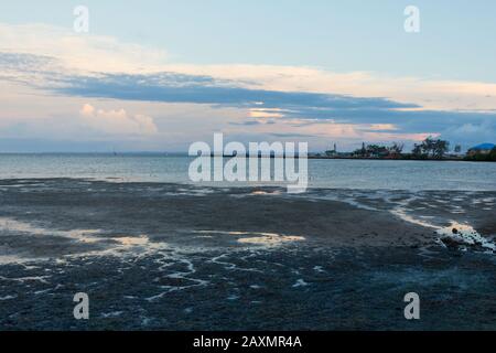 Scenic view of sea against dramatic sky during sunset Stock Photo