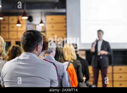 Audience listens lecturer at workshop Stock Photo