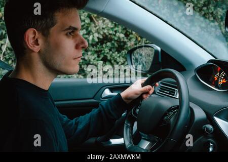 Young man driving a car Stock Photo