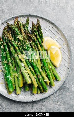Platter of lemon garlic asparagus Stock Photo