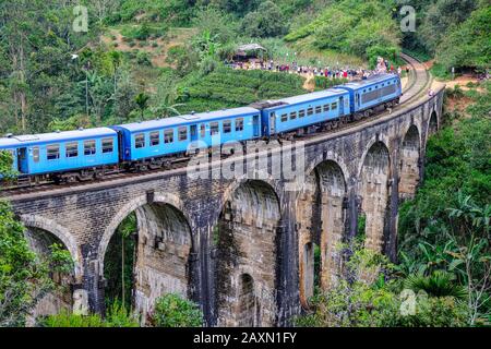 Demodara, Sri Lanka - January 2020: Train passing over the Nine Arch Bridge on January 20, 2020 in Demodara, Sri Lanka. Stock Photo