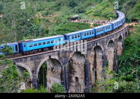 Demodara, Sri Lanka - January 2020: Train passing over the Nine Arch Bridge on January 20, 2020 in Demodara, Sri Lanka. Stock Photo