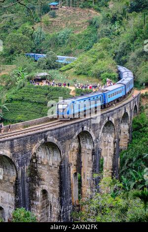 Demodara, Sri Lanka - January 2020: Train passing over the Nine Arch Bridge on January 20, 2020 in Demodara, Sri Lanka. Stock Photo