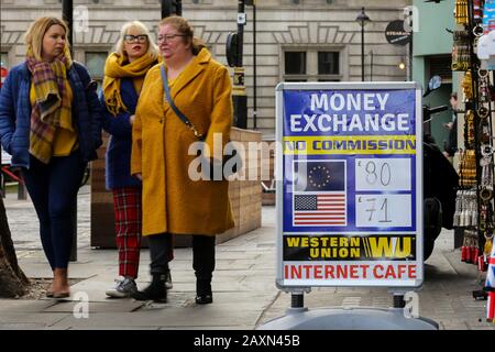 London, UK. 5th Feb, 2020. Women walk past an exchange rate board outside a currency conversion shop in central London. Credit: Dinendra Haria/SOPA Images/ZUMA Wire/Alamy Live News Stock Photo