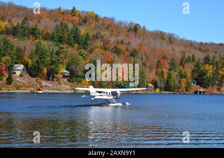 Seaplane taking off in Adirondack Mountains Stock Photo