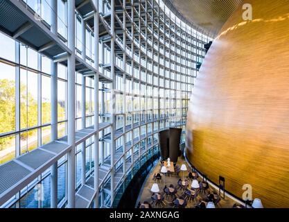 Outside view of the room housing the hemicycle of the European Parliament with a cafe terrace in the Louise Weiss building in Strasbourg, France. Stock Photo