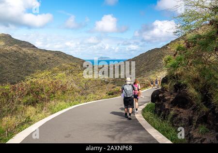 Honolulu, HI - 25 January 2020: Hikers on the trail to Makapu'u point and the lighthouse on Oahu Stock Photo