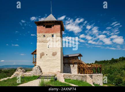Cetatea Malaiesti, restored castle on hill above village of Malaiesti, foothills of Retezat Mountains in Southern Carpathians, Transylvania, Romania Stock Photo