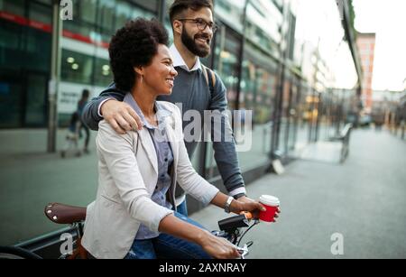Happy business people, students having fun, smiling, talking in the city Stock Photo