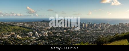 Wide panoramic image of sunset over Waikiki, Honolulu and Diamond Head from the Tantalus Overlook on Oahu, Hawaii Stock Photo