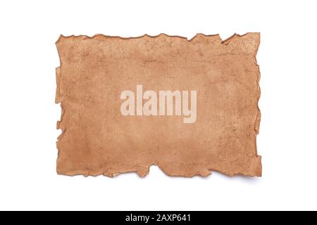 Ancient antique medieval damaged sheet of paper or parchment with ragged crumpled edges with copy space for text isolated on white background. Stock Photo